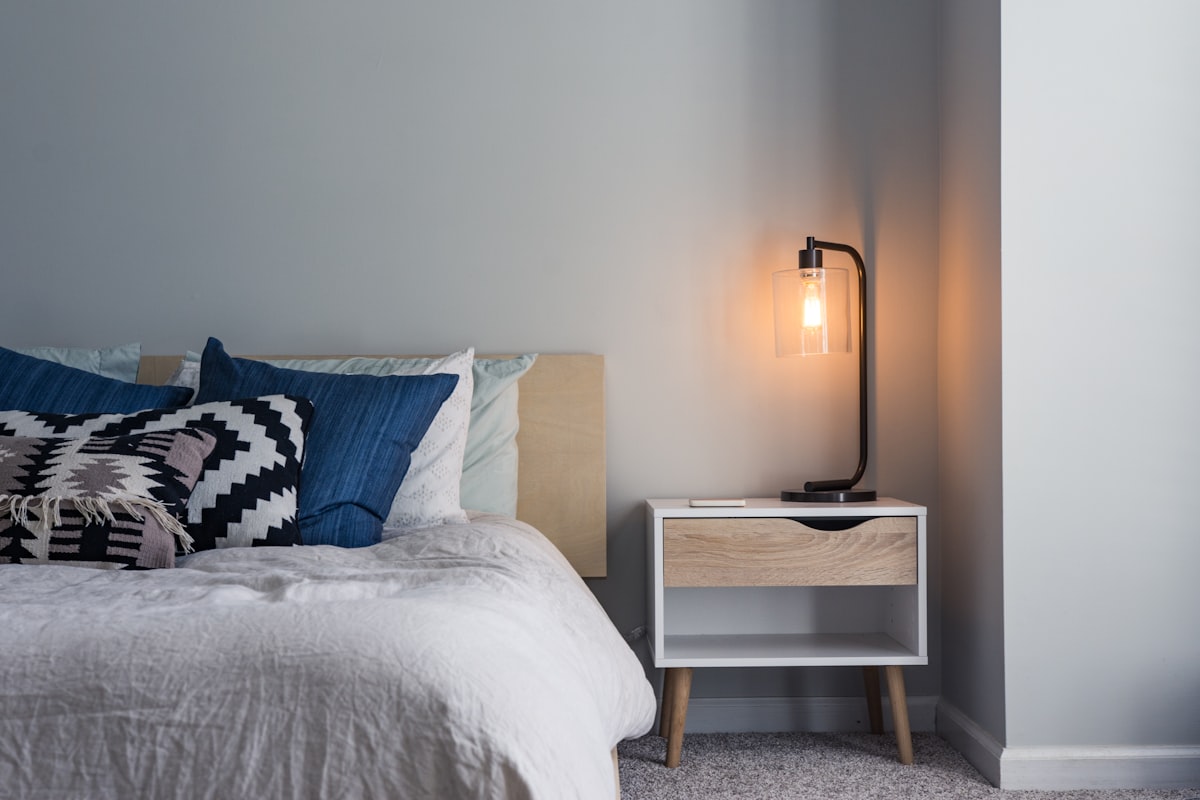 A cozy guest bedroom with fresh linens and soft lighting